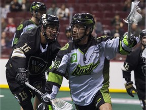 VANCOUVER January 12 2019. Vancouver Warriors #16 Mitch Jones chases after Saskatchewan Rush #74 Jeremy Thompson in a regular season NLL lacrosse game at Rogers Arena, Vancouver,  January 12 2019. Gerry Kahrmann  /  PNG staff photo) 00055908A [PNG Merlin Archive]