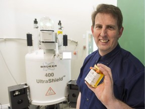 Peter Awram of the Worker Bee Honey Company in Chilliwack on Jan. 24 with his Nuclear Magnetic Resonance machine. The NMR tests the purity of honey.