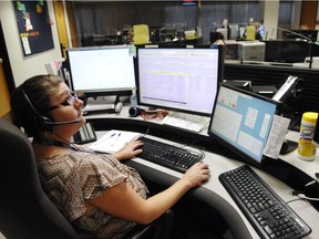 A dispatcher with the RCMP's 'F' Division, works in the Operational Communication Centre in 2012.