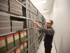 City of Saskatoon archivist Jeff O'Brien shows off the new image collection given to the archives by the Saskatoon StarPhoenix newspaper. Photo taken Feb. 6, 2019.