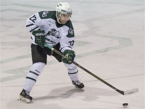 University of Saskatchewan Huskies forward Andrew Johnson moves the puck against the Mount Royal University Cougars during U Sport hockey action at Rutherford Rink in Saskatoon on Saturday, February 10, 2018