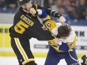 Brandon Wheat Kings defender Braydyn Chizen fights Blades forward Riley McKay during WHL action at SaskTel Centre in Saskatoon on Sunday, February 10, 2019.