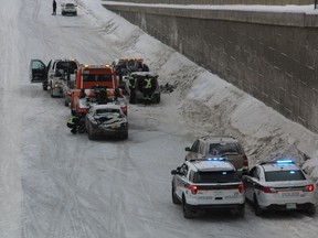 Emergency crews on Circle Drive South respond to a multiple vehicle collision on Feb. 21, 2019 in Saskatoon, Sask. Police said at least 14 vehicles were involved, and anyone who was involved with the crash who didn't speak with police at the scene should visit police headquarters to file a report.