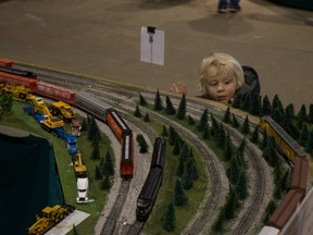 Elliot Taylor peers through the glass at the model trains rolling steadily by at the All Aboard 2019 Model Train Show at the Western Development Museum in Saskatoon on Feb. 23, 2019.