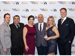 At the 27th annual Housing Excellence Awards presented by the Saskatoon & Region Home Builders' Association, Maison Design + Build received the coveted Builder of the Year award. Maison's entire staff gathered to accept the crystal statue, including company owners Jilaire and Andrew Wagner (far right). Photo: I Spy Imagery.