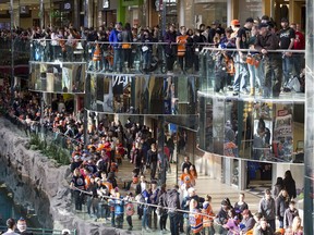 Fans line up on both levels to get autographs from the Edmonton Oilers players at West Edmonton Mall on Monday, Feb. 18, 2019.