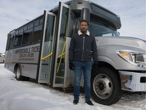 Andre Cespedes stands in front of his passenger bus near his home in the city's west end. His new business, Affordable Rides, intends to utilize the bus to transport people to and from Saskatoon.