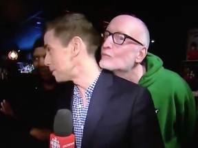In a widely seen clip, CBC's Chris Glover is talking back to the studio when one man leans into the frame behind him and mugs in front of the camera before leaving while a second man, dressed in a green Saskatchewan Roughriders hoodie, moves in on the reporter.