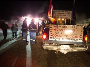 MOOSE JAW, SASK : February 14, 2019 -- Supporters of a truck convoy headed to Ottawa chat on the service road off Highway 1 near the Prairie Oasis motel in Moose Jaw as the convoy makes a stop. BRANDON HARDER/ Regina Leader-Post