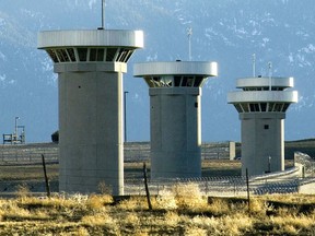 In this Feb. 21, 2007, file photo, guard towers loom over the administrative maximum security federal prison called Supermax near Florence, Colo.