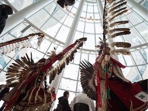 Dancers take part in the grand entry of a signing ceremony for the creation of the Red Dog urban reserve at the First Nations University.