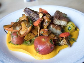 Beth Rogers and Thayne Robstad incorporate the mushrooms they pick into dishes at their Hearth restaurant such as this seared pork belly.