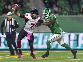 Saskatchewan Roughriders defensive end A.C. Leonard pressures Ottawa Redblacks quarterback Trevor Harris on Friday.