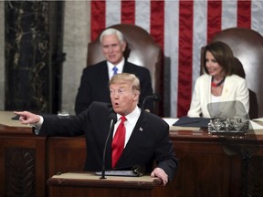 President Donald Trump acknowledges women in Congress as he delivers his State of the Union address to a joint session of Congress on Capitol Hill in Washington, as Vice President Mike Pence and Speaker of the House Nancy Pelosi, D-Calif., watch, Tuesday, Feb. 5, 2019.