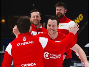 Team Canada's Matt Dunstone (front), Catlin Schneider, Dustin Kidy and Braeden Moskowy (back) celebrate their 5-4 win over Sweden's Niklas Edin in the men's final at the third leg of the Curling World Cup on Saturday.