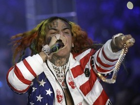 In this Sept. 21, 2018 file photo, rapper Daniel Hernandez, known as Tekashi 6ix9ine, performs during the Philipp Plein women's 2019 Spring-Summer collection during Fashion Week in Milan, Italy.