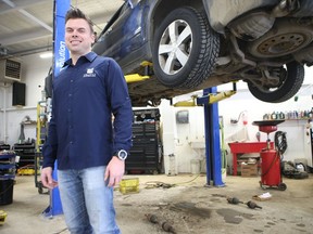 Dustin Kalthoff, the owner of Auto Connection, poses for a photo in the company's eight-car automotive bay. He hopes the business' new auto service centre will enable customers to get the highest quality of service, while allowing them access to a special membership program that will allow them some substantial discounts when they're getting work done to their car.