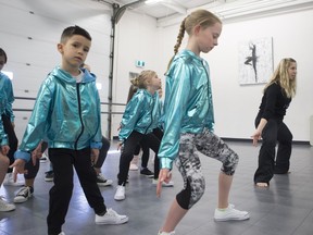 Teacher (R) Michelle Fracchia-West prepares the students to perform alongside the Mini Pop Kids at Ignite Danceworks in Saskatoon, Sk on Saturday, March 9, 2019.