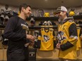Pittsburgh Penguins team captain Sidney Crosby, left, presents Humboldt Broncos bus crash survivor Layne Matechuk with his high school diploma in the team dressing room at PPG Paints Arena in Pittsburgh, Pennsylvania on Tuesday, March 12, 2019. Matechuk, whose hockey hero is Crosby, has been invited to the NHL game between Penguins and the Washington Capitals. Matechuk was not able to attend his high school graduation due to the bus crash.