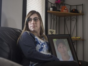 Celina Danis, who's partner died in a workplace accident in 2016, stand for a photograph in her home in Saskatoon.