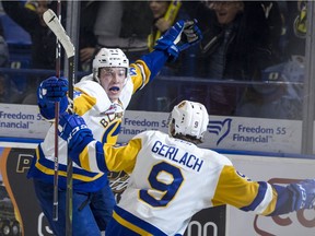 SASKATOON,SK--MARCH 22/2019-0323 Sports Blades- Saskatoon Blades forward Chase Wouters celebrate the game winning goal with forward Max Gerlach against the Moose Jaw Warriors during overtime of WHL playoff action at SaskTel Centre in Saskatoon, SK on Friday, March 22, 2019.