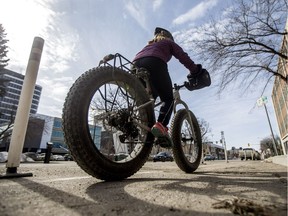 SASKATOON,SK--MARCH 25/2019-*0326 News Bike Lanes- Andrea Hill uses a bike lane along 23rd St. in Saskatoon, SK on Monday, March 25, 2019.