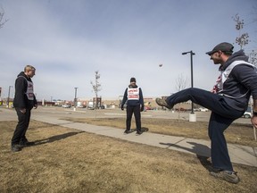 Striking Saskatoon Co-op employees play Hacky Sack near the Co-op's hardware store on Eighth Street.
