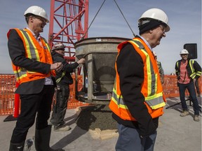 Karim Nasser of Victory Majors Development, right, and Mayor Charlie Clark, left, during a media event for the topping ceremony for the office tower on Parcel Y at River Landing in Saskatoon, SK on Tuesday, March 26, 2019.