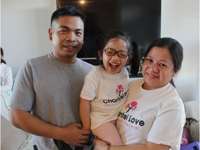 Teresa Ramirez, right, with her husband, Sonny, and daughter Chantel at their home in Saskatoon, Sask. on Friday, March 22, 2019. Chantel, who is four years old, has a rare genetic condition known as Troyer Syndrome. Her family is campaigning to raise funds and awareness for the little girl.