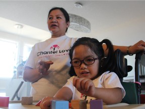 Teresa Ramirez, left, with her daughter Chantel at their home in Saskatoon, Sask. on Friday, March 22, 2019. Chantel, who is four years old, has a rare genetic condition known as Troyer Syndrome. Her family is campaigning to raise funds and awareness for the little girl.