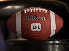 A football with the new CFL logo sits on a chair during a media conference in Winnipeg, Friday on November 27, 2015.