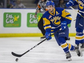 Saskatoon Blades forward Max Gerlach moves the puck against the Prince Albert Raiders during 3rd period WHL action at SaskTel Centre in Saskatoon, SK on Sunday, October 14, 2018.