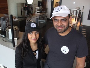 Vinita Patel, left, and Jignesh Patel, owners of The Dapper Doughnut in Saskatoon's StoneBridge neighbourhood, can be seen in front of the Dapper Doughnut Kitchen on Feb. 23, 2019. The first franchise of its kind in Saskatoon and in Canada, the shop offers a wide variety of well-dressed desserts.