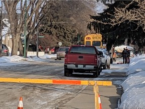 Police respond to a collision involving a school bus at 2nd Street East and Clarence Avenue South on Friday March 8, 2018. (Erin Petrow/Saskatoon StarPhoenix)
