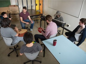 Clinton Ackerman (second from left at top) conducts a music exercise at Argyle School.