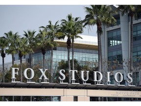 The Fox Studios sign is pictured at the entrance to the lot, Tuesday, March 19, 2019, in Los Angeles. Disney's $71.3 billion acquisition of Fox's entertainment assets is set to close around 12 a.m. EDT on Wednesday.