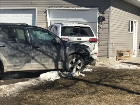The Saskatoon fire department responded to a collision on Junor Avenue where a vehicle collided with a parked vehicle pushing it into the attached garage of a home on Wednesday March 20, 2019. . (Supplied)