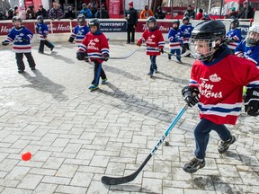 A kids ball hockey game is underway during the Rogers Hometown Hockey festival being held in City Square Plaza.