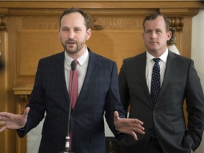 NDP leader Ryan Meili (left, flanked by finance critic Trent Wotherspoon) reacts to the budget details that were released ahead of time to the media at the Legislative Building in Regina.