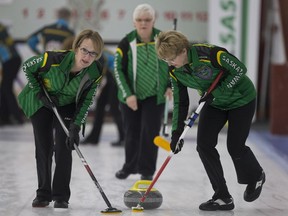 Saskatchewan second June Campbell and Third Beverly Krasowski sweep in front of the ice during the Canadian masters curling championship at the Nutana Curling Club in Saskatoon, Sk on Thursday, April 4, 2019.