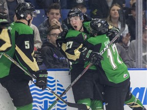 Prince Albert Raiders defence Zack Hayes, left to right, forward Parker Kelly and forward Dante Hannoun celebrate a short-handed goal against the Saskatoon Blades during the first period of WHL playoff action at SaskTel Centre in Saskatoon on Wednesday, April 10, 2019.