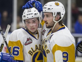 Saskatoon Blades forward Kyle Crnkovic, left, and forward Max Gerlach reacts after losing the game and series to the Prince Albert Raiders in WHL playoff action at SaskTel Centre in Saskatoon on Sunday, April 14, 2019. The Raiders defeated the Blades 6-3 and take the series and advance to the next round of playoffs.