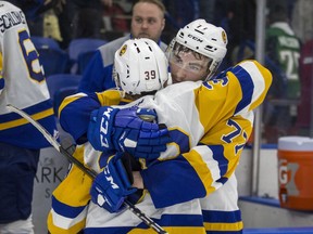 Saskatoon Blades forward Riley McKay, left, and forward Kirby Dach hug after losing the game and series to the Prince Albert Raiders in WHL playoff action at SaskTel Centre in Saskatoon, SK on Sunday, April 14, 2019.