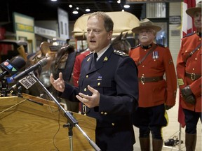 Mark Fisher, Sask. RCMP Commanding Assistant Commissioner, is surrounded by people wearing historic RCMP uniforms at the Western Development Museum in Saskatoon on April 19, 2019. Officials with the Government and RCMP say the Crime Watch Advisory Network is expanding as it saw a strong start in regards to the number of people who are signing up.
