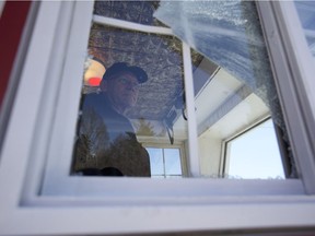 Prairie Lily Captain Mike Steckhan, photographed through one of the windows that sustained damage during a string of vandalism on board during the early hours of April 17, 2019