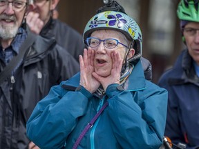 Cathy Watts leads a group of cyclists in a chant.  Cyclists gathered for a rally in front of City Hall before a city council meeting to decide the fate of Saskatoon's bike lanes in Saskatoon, Sask. on Monday, April 29, 2019.