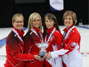 Sherry Anderson (left), Patty Hersikorn, Brenda Goertzen and Anita Silvernagle hold their trophy after winning the world senior women's curling championship Saturday in Stavanger, Norway. (World Curling Federation/Alina Pavlyuchik)