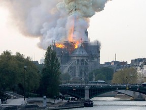 Flames rise during a fire at the landmark Notre-Dame Cathedral in central Paris on April 15, 2019.