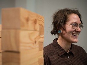 Katherine Boyer stands near a piece of her art, which is part of an exhibition entitled Labour is the Body; Time is the Bridge being shown beginning April 13, 2019 at Neutral Ground Gallery.