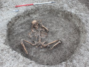 Believed to be a female skeleton buried with feet cut off and placed by her side with arms bound behind her head about 3,000 years ago.